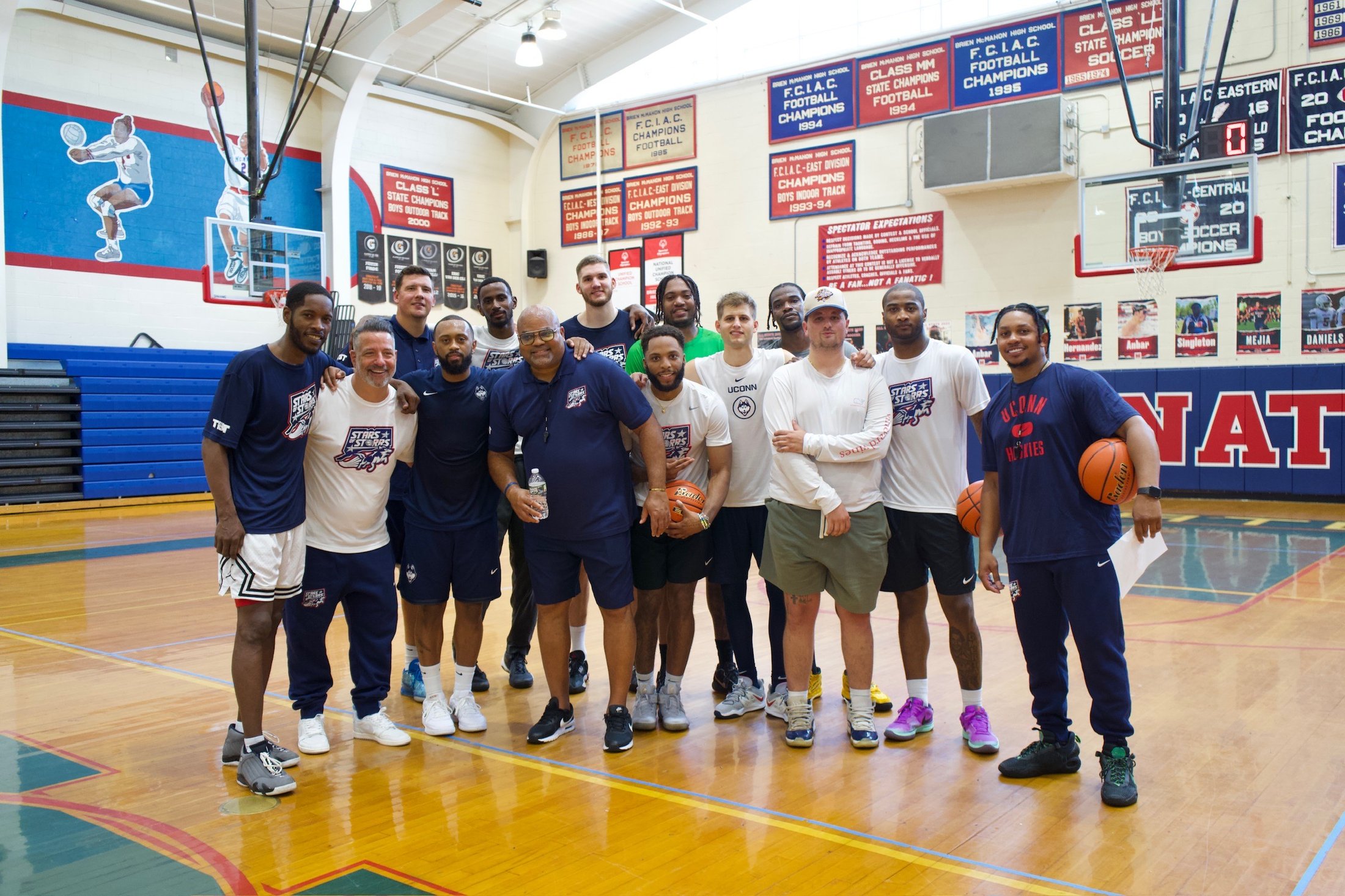 The Stars of Storrs team and coaching staff at Brien McMahon High School